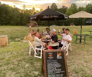 Guests enjoying a meal on the patio at Backyard Bistro. 